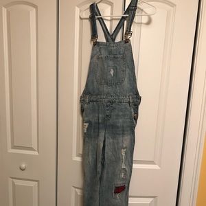 Ripped denim overalls